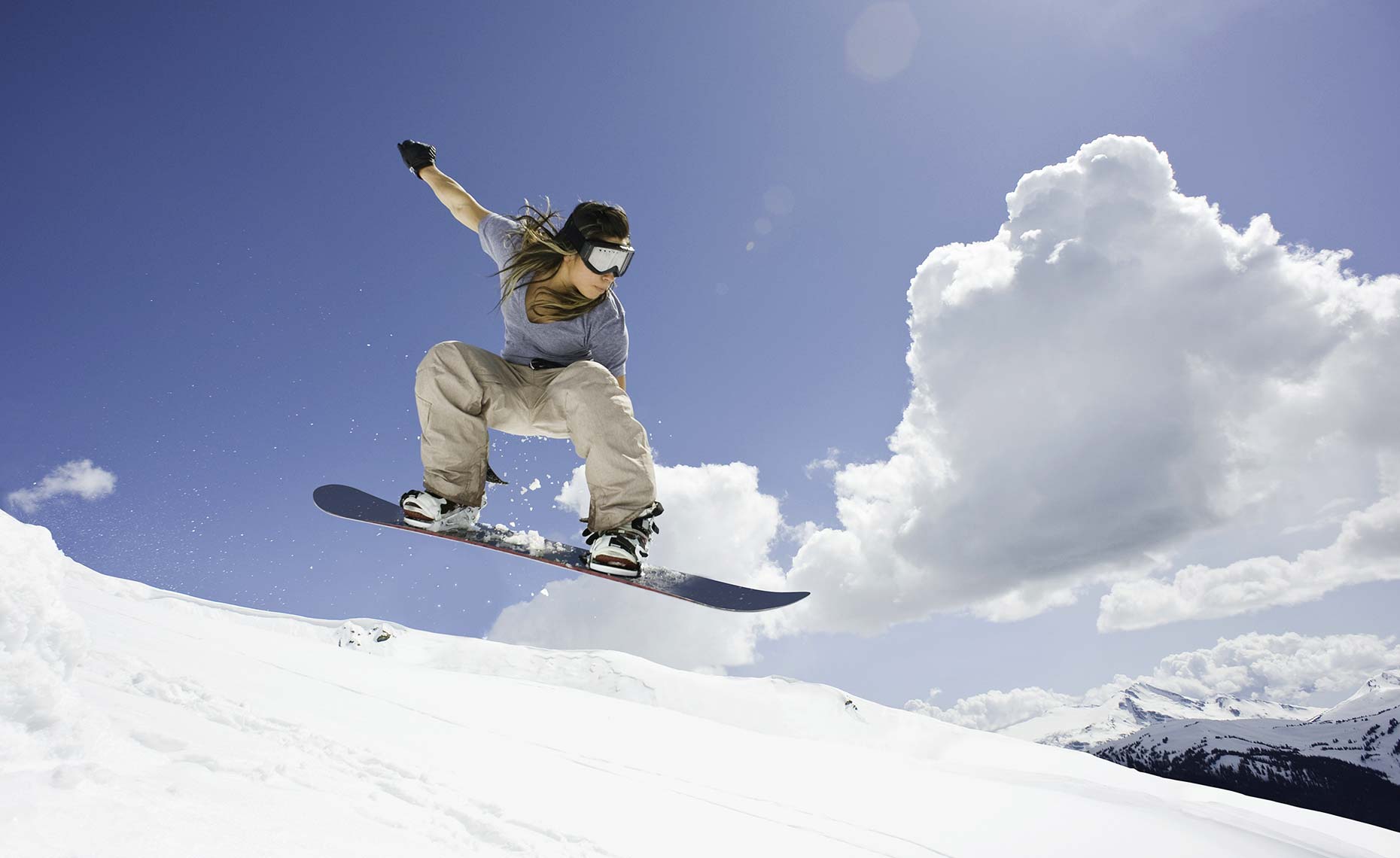 Whistler female snowboarder jumping
